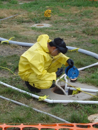 Sathapom Onanong checks groundwater levels during an in situ chemical oxidation.