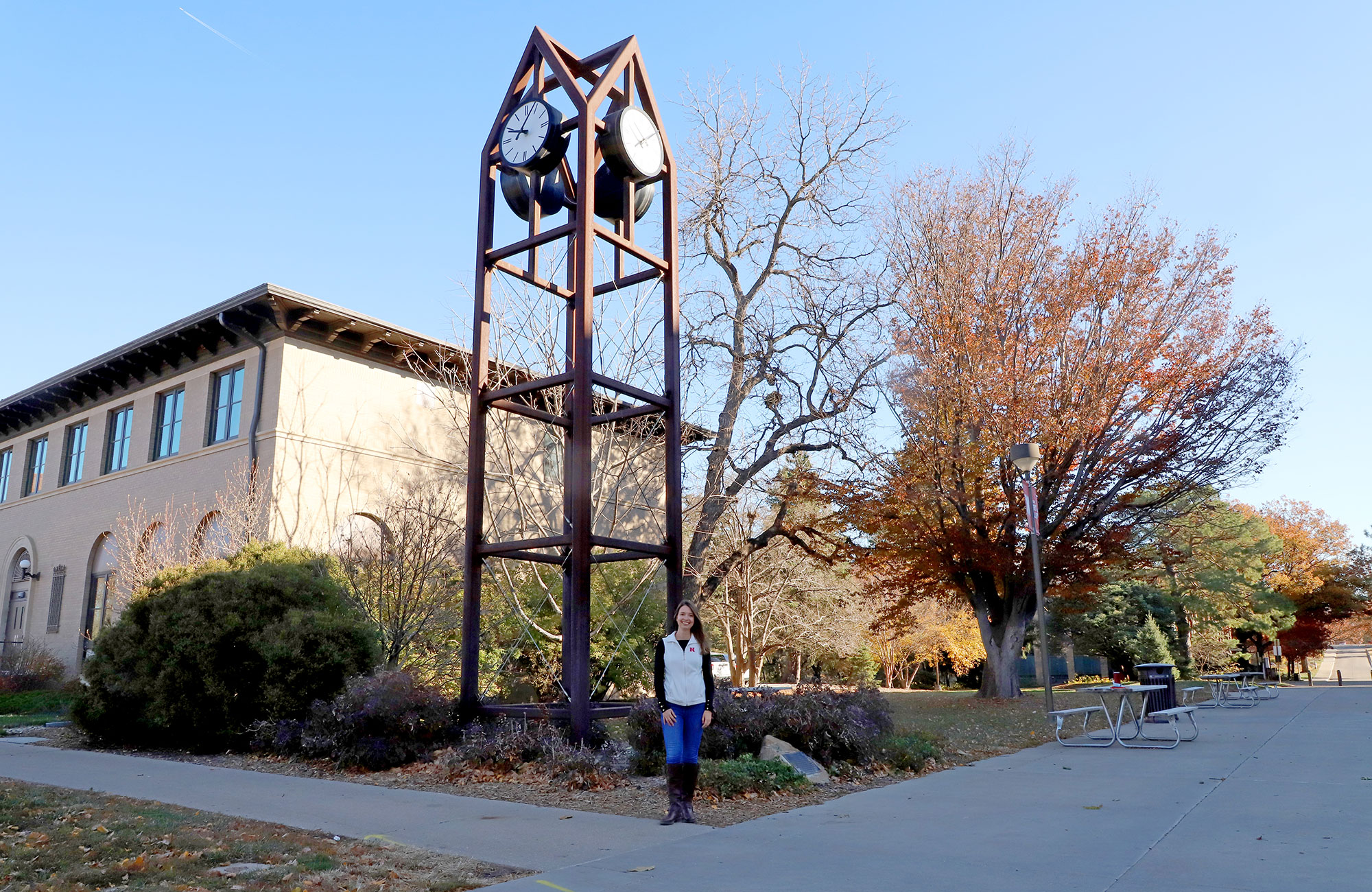 Fernanda Krupek, a 2021 fellowship recipient, stands next to the East Campus clock tower donated by the Heuermanns. Krupek is studying cropping systems and soil health management in Agronomy and Horticulture.