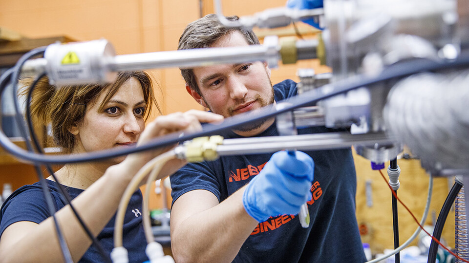 Graduate students Zahra Ahmadi and Mark Anderson work in the Scott Engineering Center in November 2019. Craig Chandler | UComm