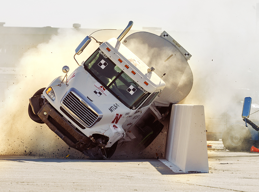 The roadside barrier developed by University of Nebraska–Lincoln researchers holds firm as a fully-loaded tractor-tanker vehicle slams into it during a Dec. 8 test. 