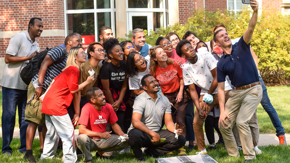 International and domestic students gathered for a photo after enjoying ice cream at the International Student and Scholar Office’s welcome back event in August. © Mia Azizah, Office of Global Strategies