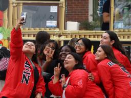 Sorority members pose for a group selfie at MGC & NPHC: Back to School Block Party.