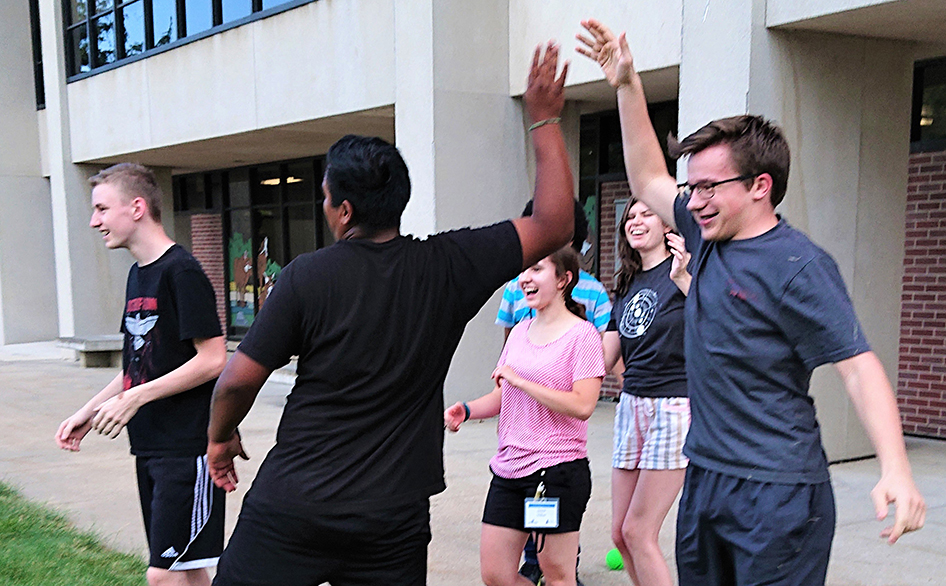 YNS campers celebrate during an outdoor activity