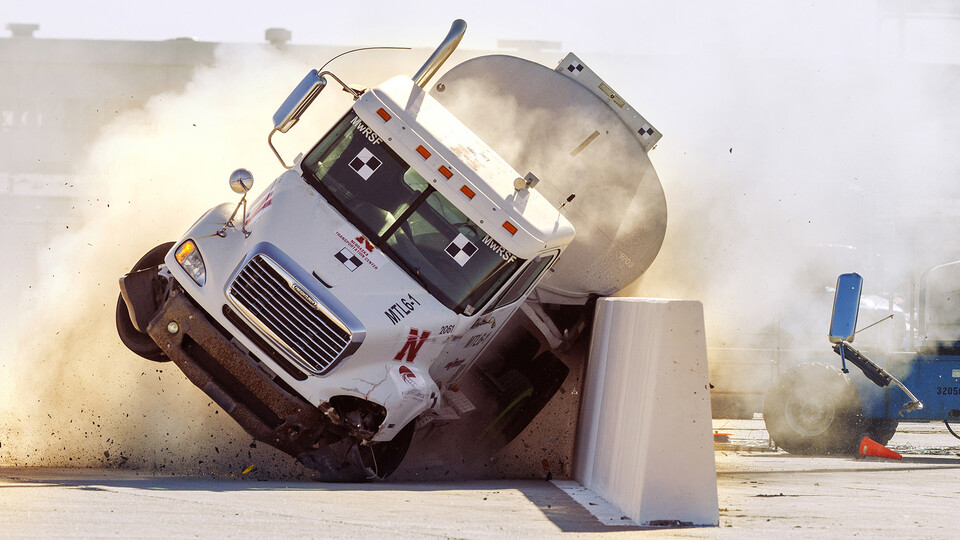 The roadside barrier developed by University of Nebraska–Lincoln researchers holds firm as a fully-loaded tractor-tanker vehicle slams into it during a Dec. 8 test. (Craig Chandler, UComm)