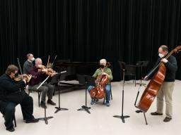 The Una Corda Ensemble, which features (left to right) David Neely, Mark Clinton, Clark Potter, Karen Becker and Hans Sturm, will perform Feb. 15 in Westbrook Rm. 119. Photo by Eddy Aldana.