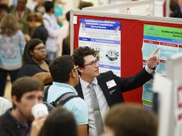 A student presents research at the Nebraska Summer Research Symposium in 2019.