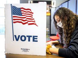 Grace Carey, a freshman from Bellevue, Nebraska, votes in her first election Nov. 3, 2020.