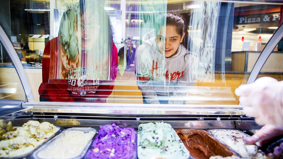 Students select gelato from the Abel-Sandoz Dining Center in this file photo taken before face coverings were required when indoors on campus. The university has expanded availability of dining options for students this semester.