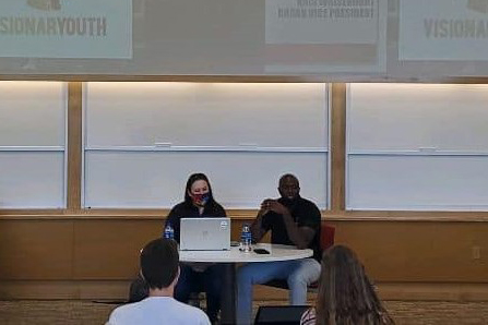 L-R: Visionary Youth leaders Kris Whisenhunt (Vice President) and Kwabena Mensah (Founder and Executive Director) speak to the MNGT411 class about their organization during the Fall 2021 semester. 