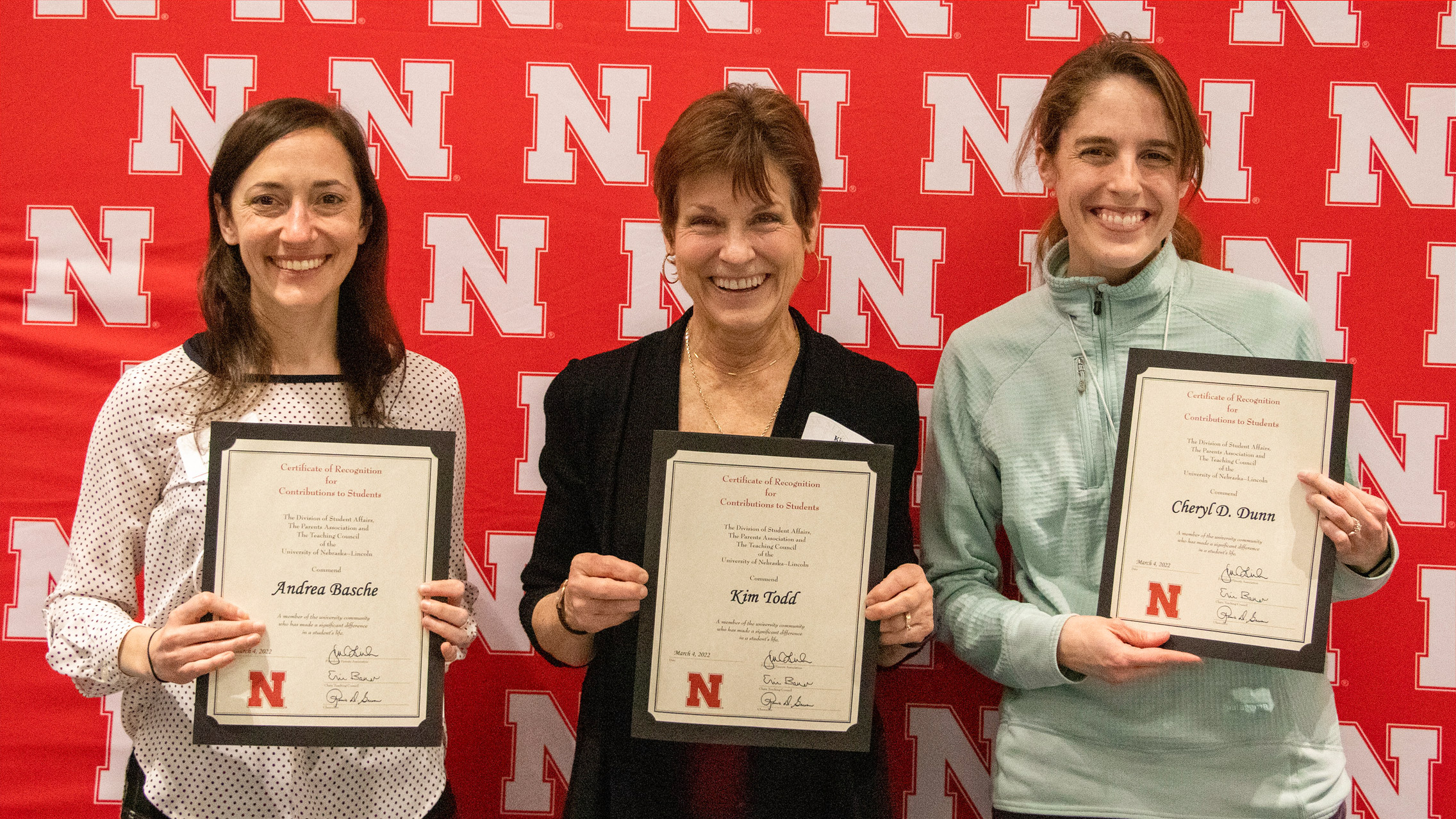 Andrea Basche (from left), Kim Todd and Cheryl Dunn are honored at the 2022 Family and Friends Recognition Awards ceremony March 4. Mike Jackson | Student Affairs Marketing & Communication