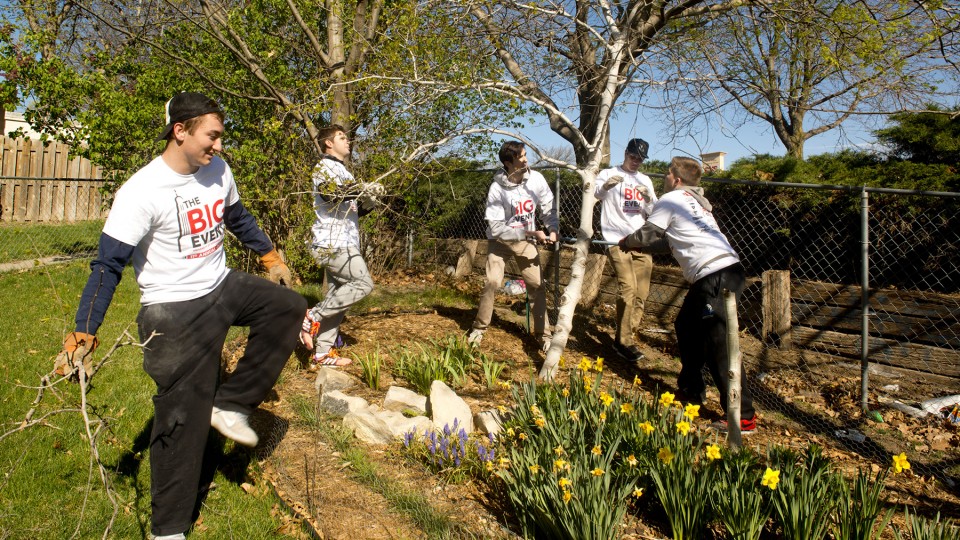 Members of Sigma Alpha Epsilon fraternity at the University of Nebraska–Lincoln clear trees and yard waste at a Lincoln residence during a previous year's The Big Event. The upcoming day of service is set for April 23, 2022. [University of Nebraska–Lincol