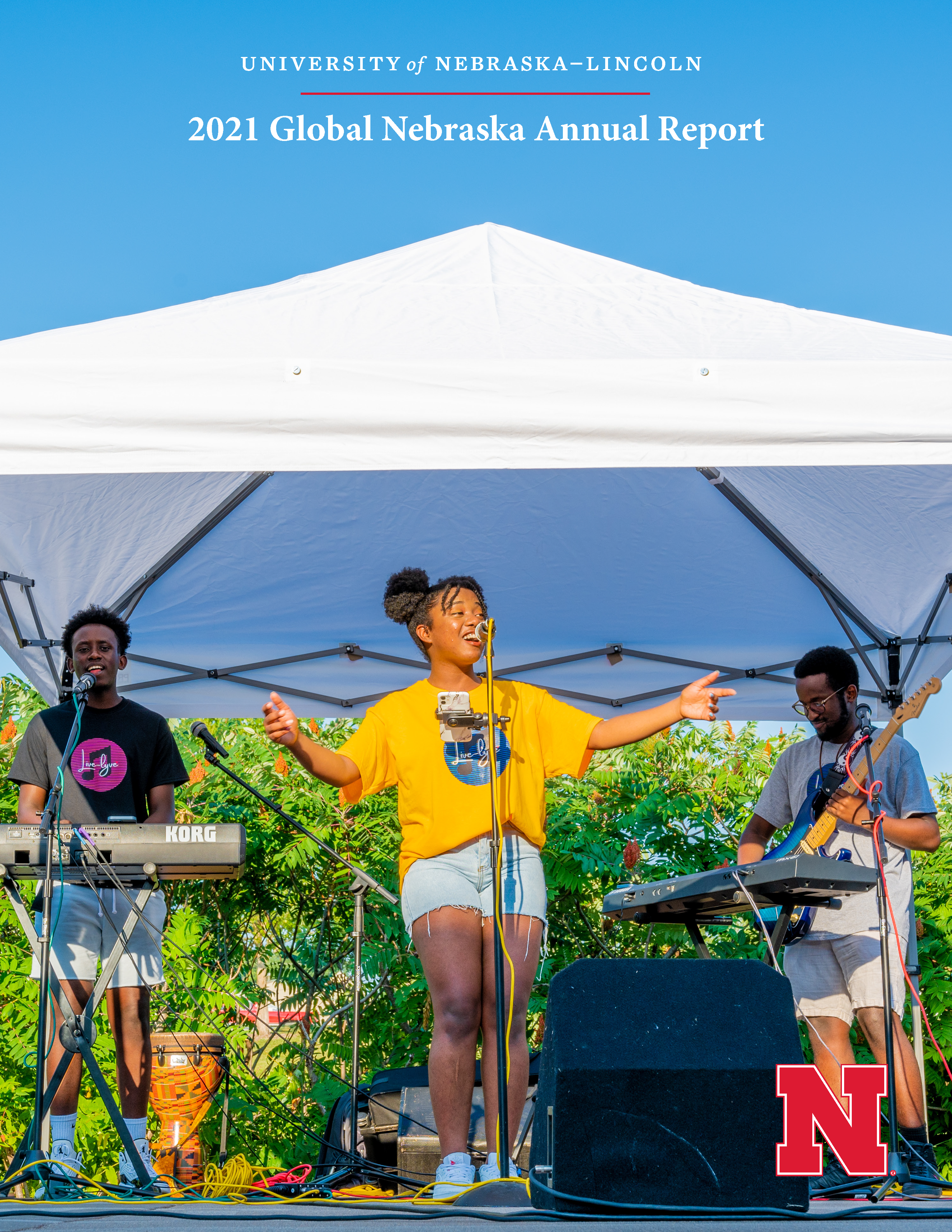 The front cover of the 2021 report features Live Lyve Band, a group of Nebraska students from Rwanda, performing at a community concert that celebrated the end of one of the College of Business’s Global Experience courses last summer. Photo Credits: Garre