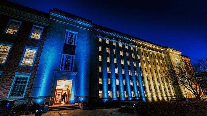 Love Library lit in blue and yellow - the colors of the flag of Ukraine.