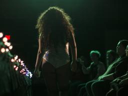 A performer walks in the audience during a drag show previously hosted by the LGBTQA+ Center.