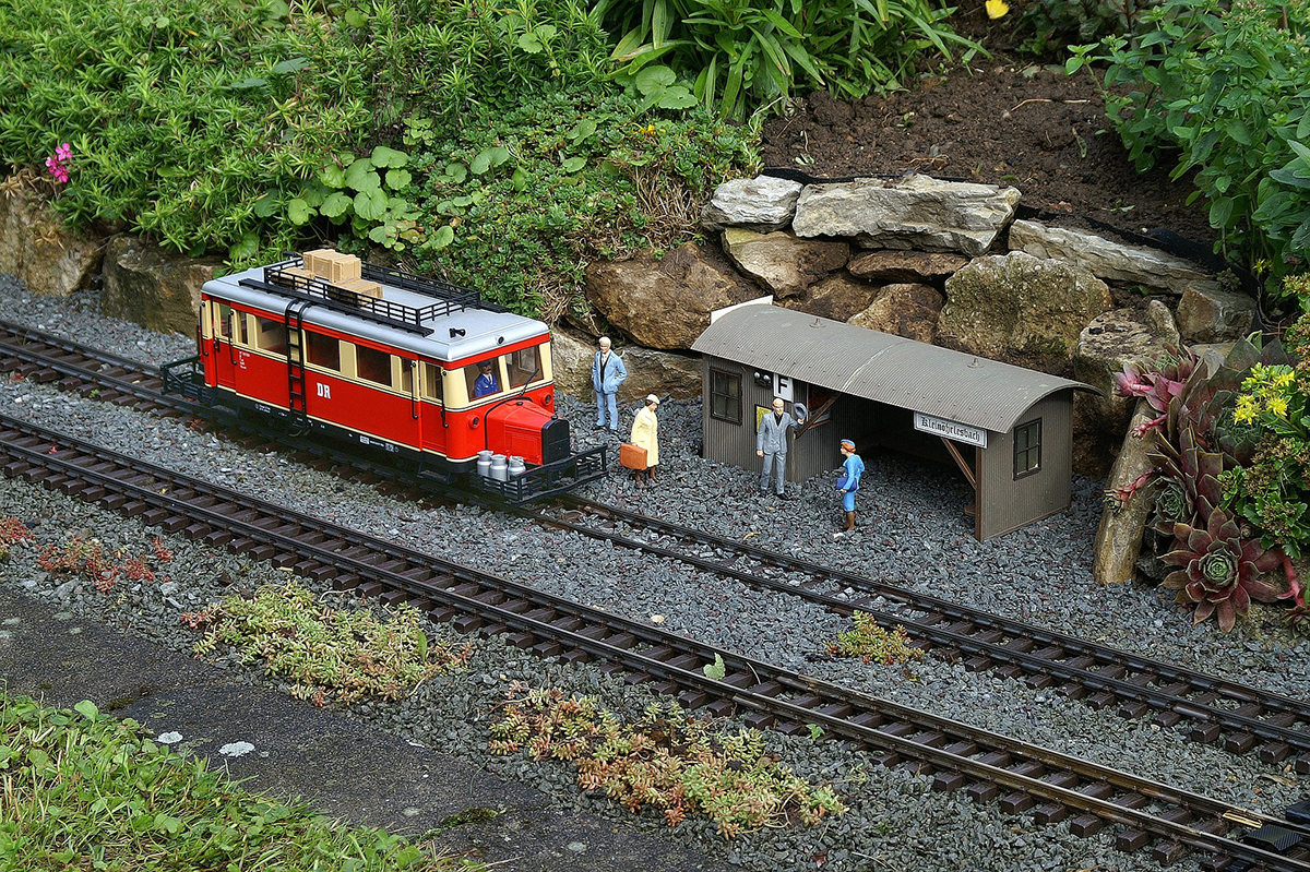 A train station makes a great focal point for a young train-lovers miniature garden. (Photo from Pixabay.)