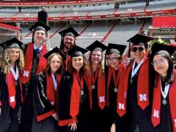 Left to right: Payton Bergkamp, Mike Rapsys, Kayla LaPoure, Mitchell Guynan, Allison Lund, Megan Whisenhunt, Madeline Schmit, Angela Walsh and Annie Wang are the first Emerging Media Arts alumni. Courtesy photo.