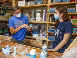 Eddie Dominguez, professor of art, works with UCARE student Kinga Aletto in August 2020. 