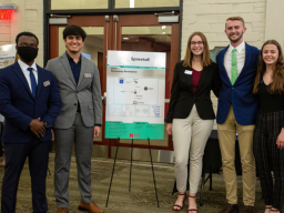 Team Spreetail, (from left) Bertrand Sibomana, Ritvik Handa, Ciara Baumert, Ben Hanson and Katie Leger, poses with their project poster at the Design Studio Showcase.