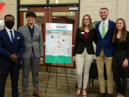 Team Spreetail, (from left) Bertrand Sibomana, Ritvik Handa, Ciara Baumert, Ben Hanson and Katie Leger, poses with their project poster at the Design Studio Showcase.