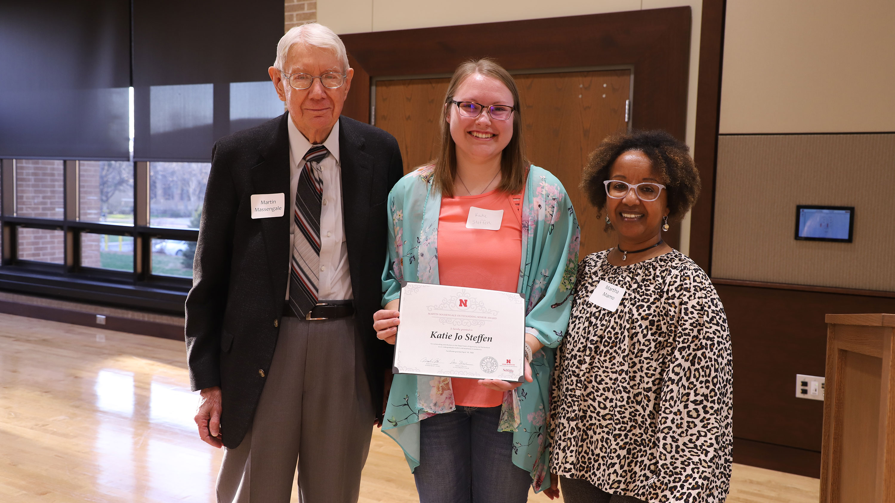 Martin Massengale (left) and Martha Mamo (right) present Katie Jo Steffen with the Martin Massengale Outstanding Senior Award at the Agronomy and Horticulture Spring Banquet April 18.