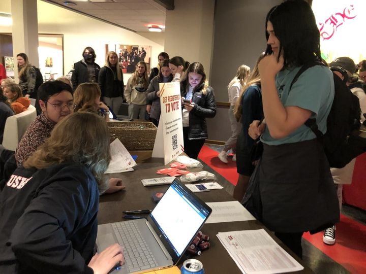 UNL students Ken Bartling and Ivain Molina assisted huskers with registering to vote in spring 2022
