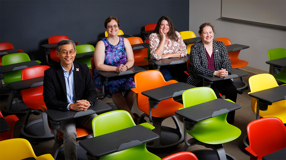 Leen-Kiat Soh (from left), Wendy Smith, Mindi Searls and Brittany Duncan sit in Avery Hall. (Craig Chandler, UComm)