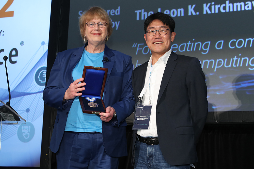 Marilyn Wolf, founding director of the School of Computing and Elmer E. Koch Professor of Engineering, is presented the IEEE Leon K. Kirchmayer Graduate Teaching Award from Gi-Joon Nam, president of the IEEE Council on Electronic Design Automation.