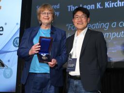Marilyn Wolf, founding director of the School of Computing and Elmer E. Koch Professor of Engineering, is presented the IEEE Leon K. Kirchmayer Graduate Teaching Award from Gi-Joon Nam, president of the IEEE Council on Electronic Design Automation.