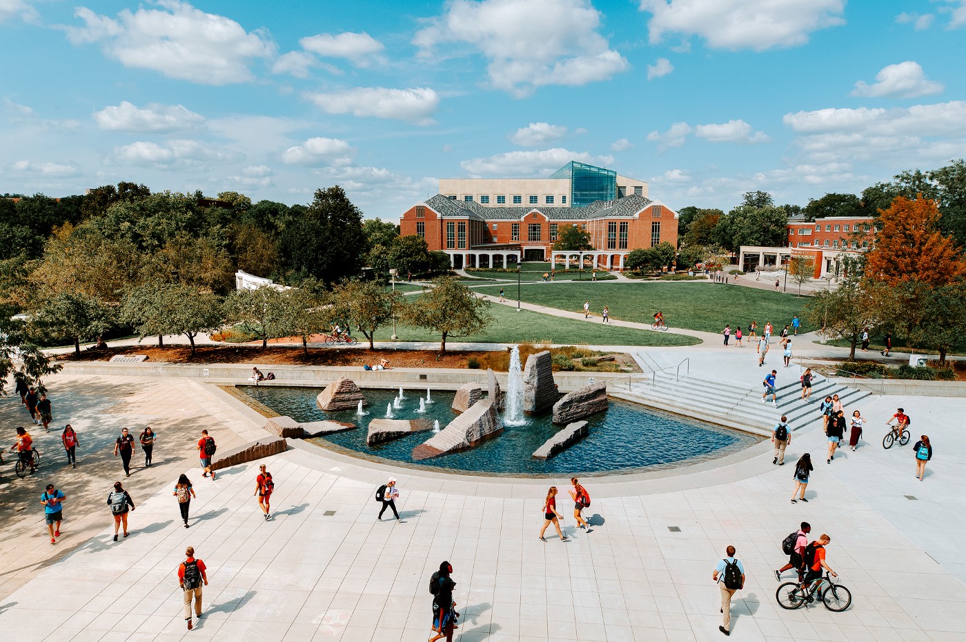 Huskers cross campus in front of Broyhill Fountain.