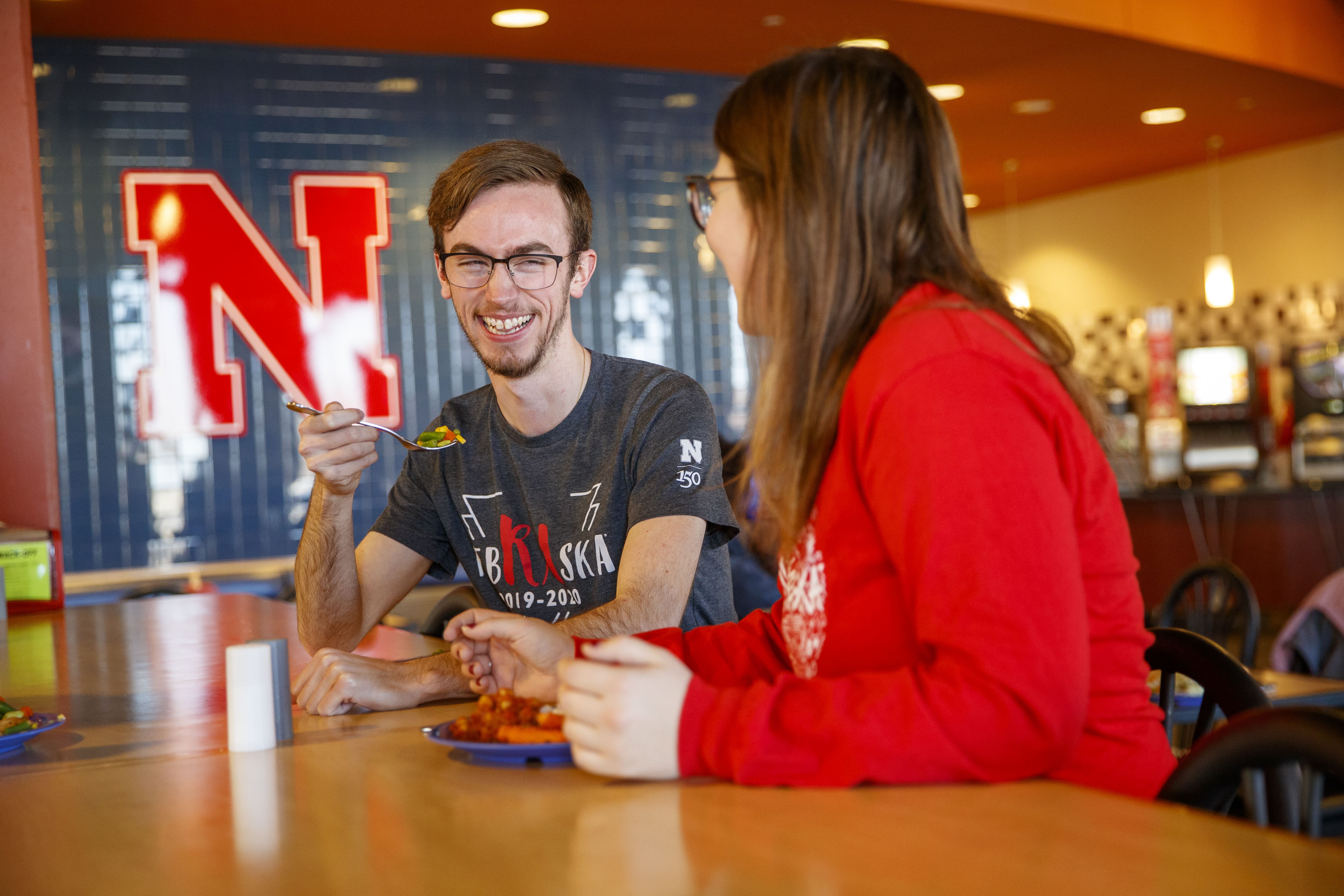 Students converse and dine in the Harper Dining Center