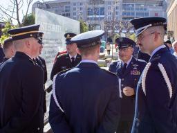 Military service members chat after the dedication of the new Veterans’ Tribute space on Sept. 11.  [Gus Kathol | University Communication and Marketing]