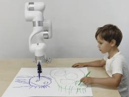 Left: Robert Twomey; Right: Robot and child completing a drawing transfer. Courtesy photo.