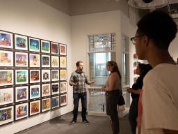 LPS Grad and Award-Winning Visual Artist Trent Claus guides Arts and Humanities students through his exhibition.
