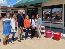 Rural Fellows Alicia Pannell (left), Tori Pedersen (second from left) and Janet Kabetesi (fifth from left) and community fellows Andrea McClintic (fourth from left) and Stephanie Novoa (right) are pictured with Lt. Gov. Mike Foley (third from left) at the