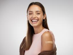 Student shows off their flu shot bandage.