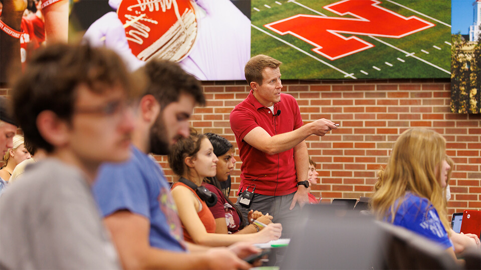 Brian Couch (center), associate professor of biological sciences, discusses chemical elements with students in his LIFE 120 class.