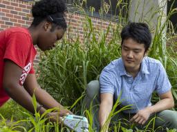  Clementine Ewomsan, a member of the STEM-POWER Research Program’s 2022 summer cohort, works with Yuguo Yang, a graduate student in biological sciences, during her summer research appointment. 