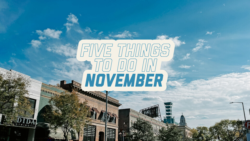 Text reading "5 Things to Do in November" sits over a photo of shops on 14th street in downtown Lincoln.