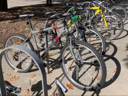 Several bicycles are secured with cables and locks in a outside bike rack at the University of Nebraska–Lincoln. [Christopher Dulak | Student Affairs]