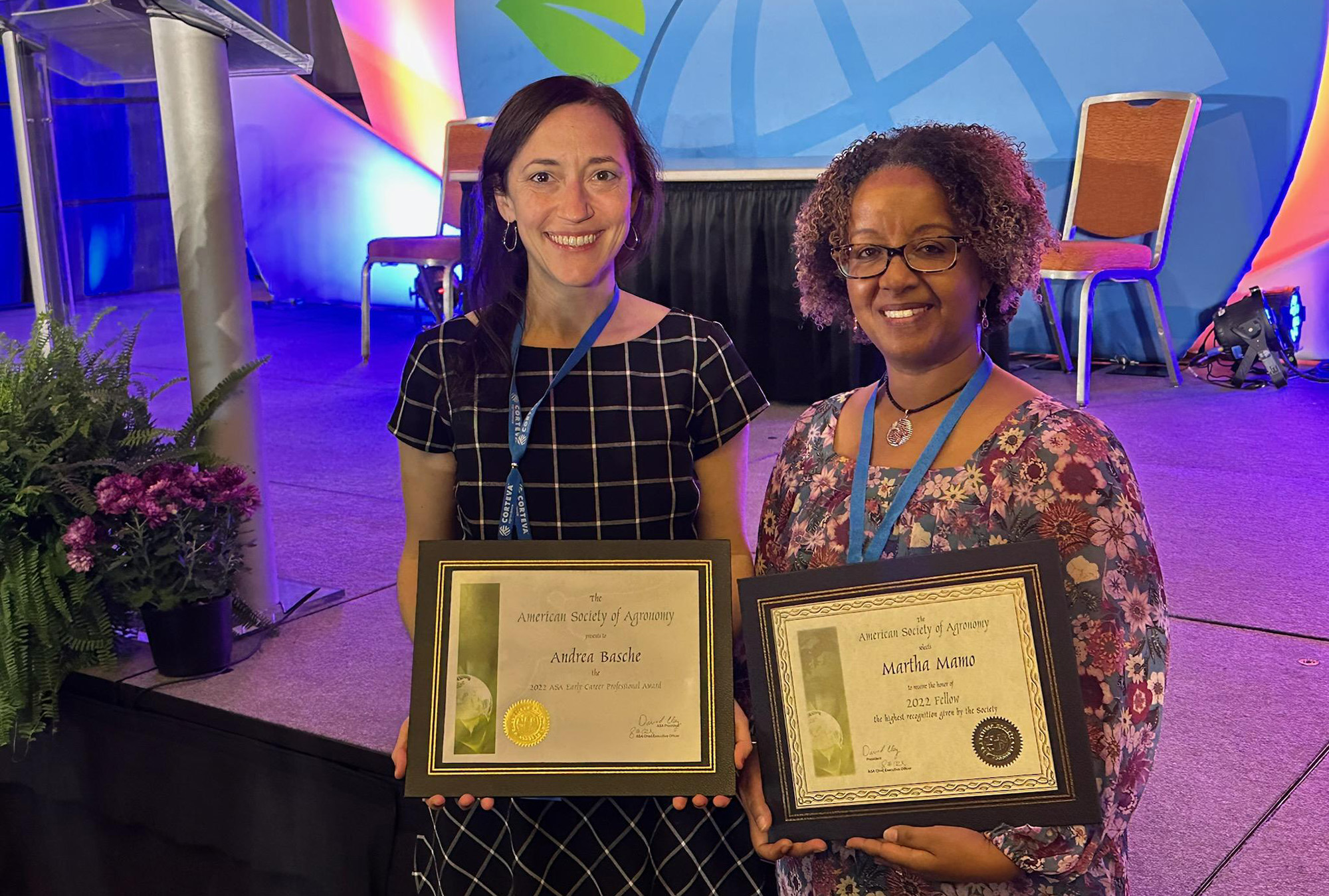 Andrea Basche (left) and Martha Mamo are formally presented with ASA awards at the ASA-CSSA-SSSA International Annual Meeting in Baltimore Nov. 8.