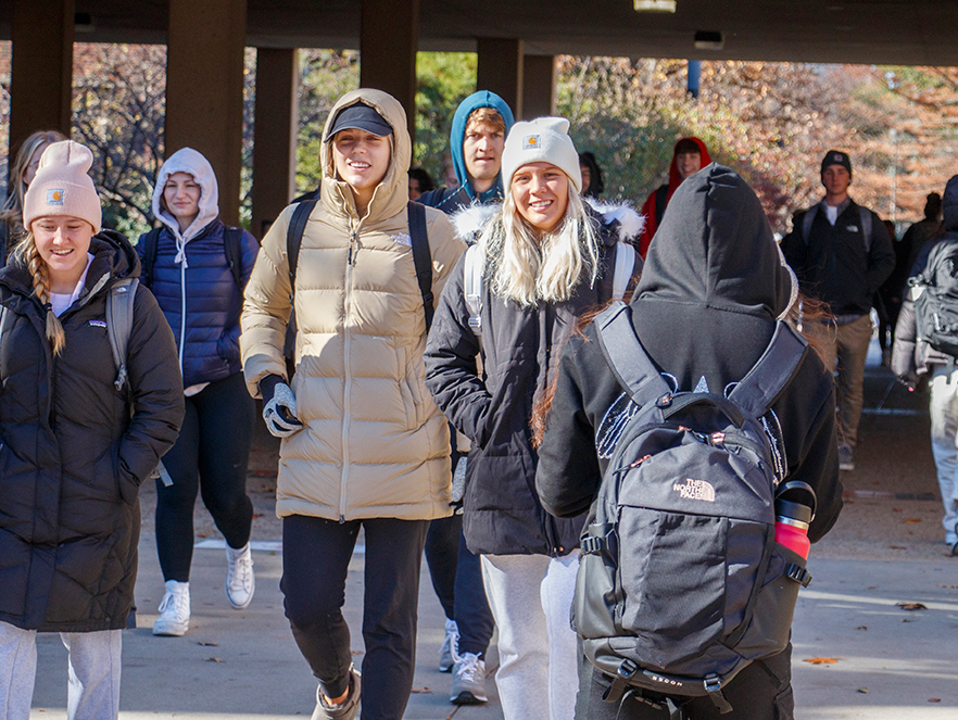Students at the University of Nebraska–Lincoln bundle up in coats and winter gear as deep cold weather arrives on campus. November 11, 2022.