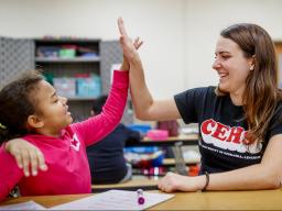 A College of Education and Human Sciences student volunteering after school in the America Reads Program.