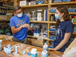  Eddie Dominguez, professor of art, works with UCARE student Kinga Aletto in August 2020.