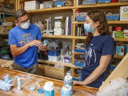Eddie Dominguez, professor of art, works with UCARE student Kinga Aletto in August 2020.