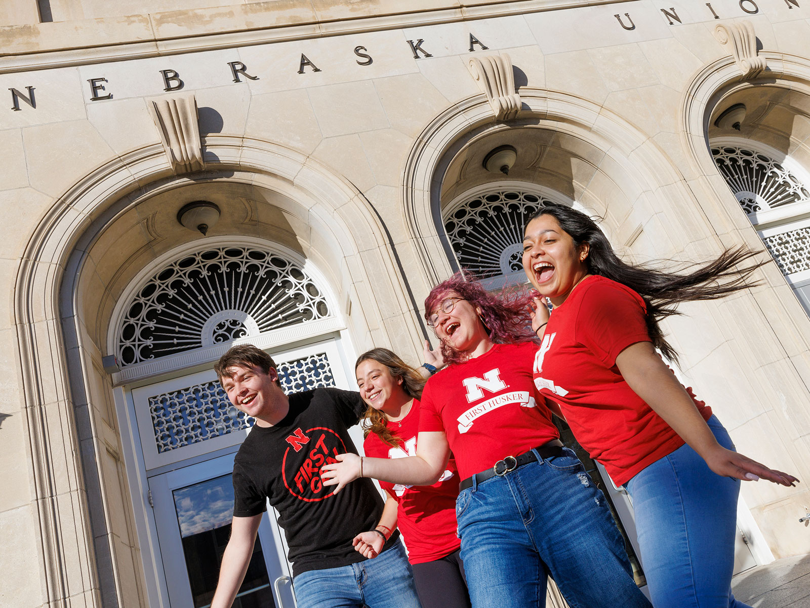 Students pose for a photo outside of the Nebraska Union.