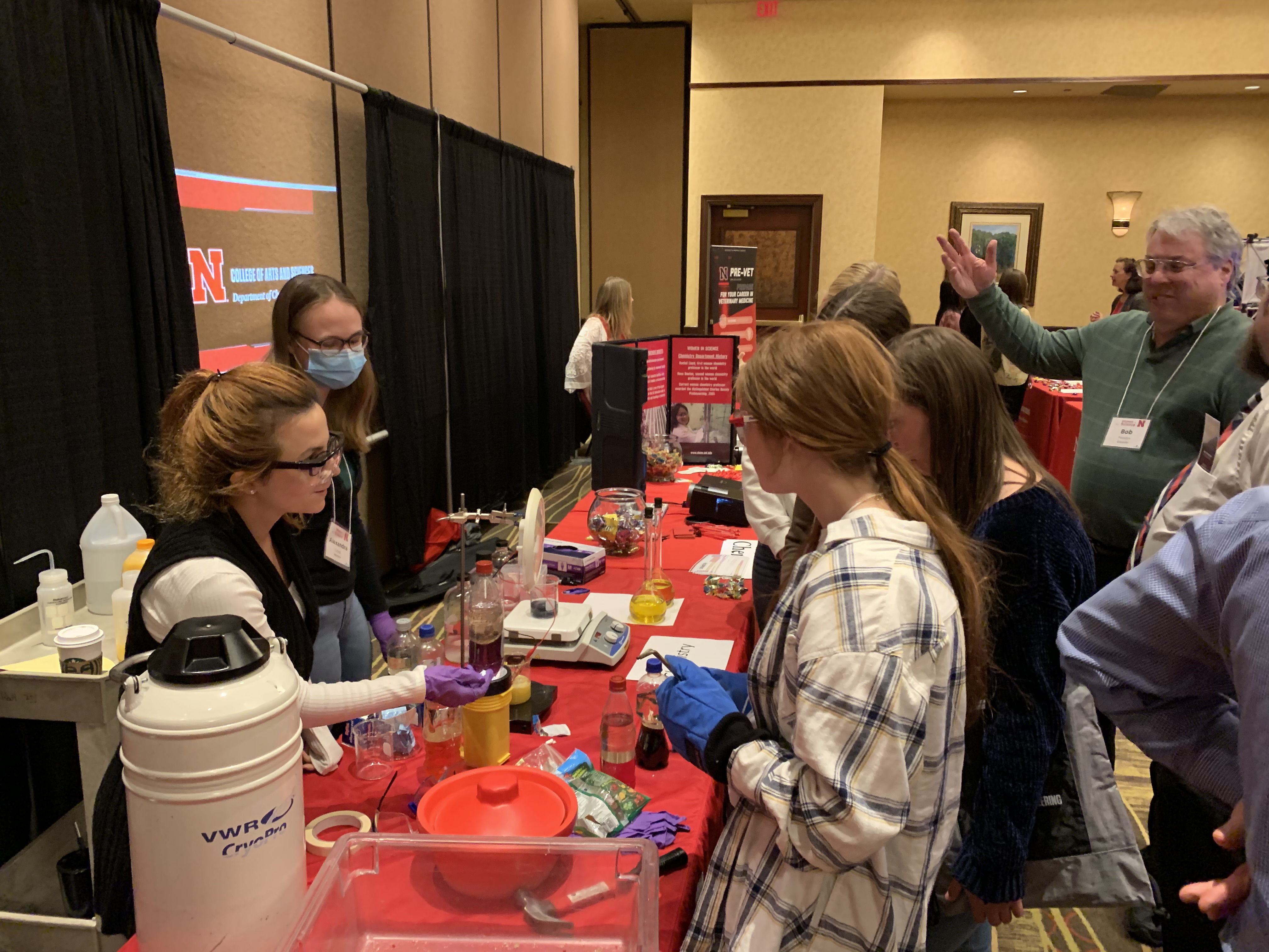 Chemistry showcases experiments at the department fair at the 2022 Women in Science Conference.