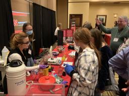 Chemistry showcases experiments at the department fair at the 2022 Women in Science Conference.