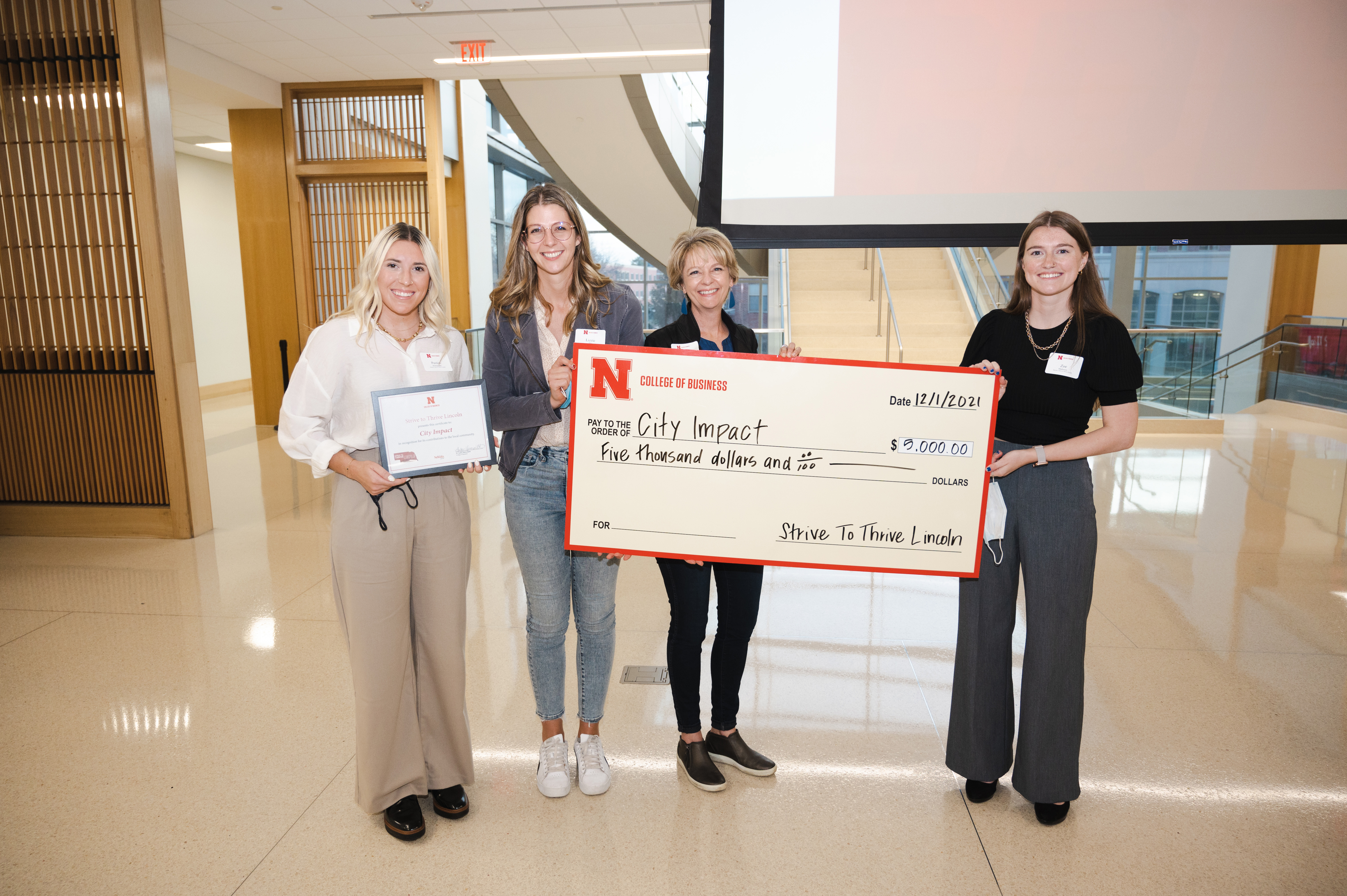 Representatives of City Impact accept the grant at the Fall 2021 Grant Ceremony.