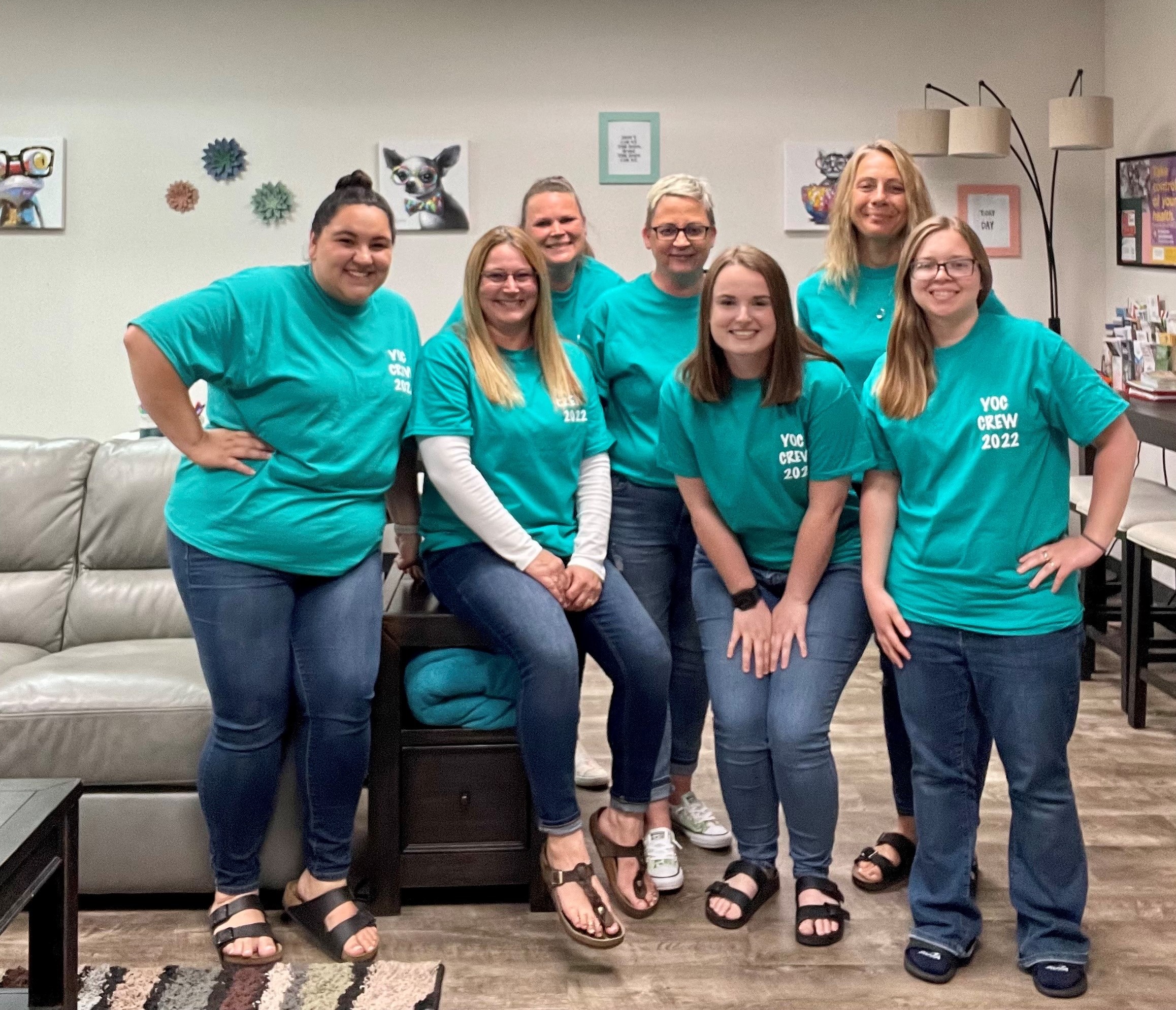 Youth Opportunity Center (YOC) staff in the space. Christina Lloyd, program director, is third from the left. Members of the Fall '22 class helped paint the space as a service project.