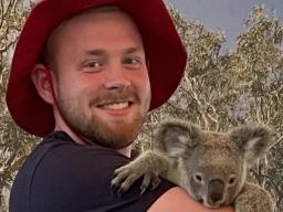 UNL student Will Hattery holding a koala in Australia.